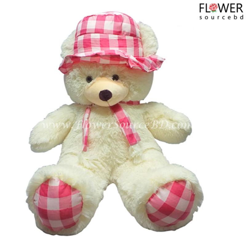 White Teddy wearing pink tie